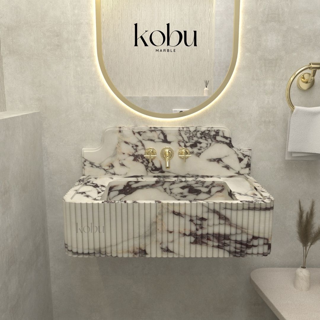 Front view of a handcrafted 30-inch fluted Calacatta Viola marble sink, showcasing elegant veining and polished finish.