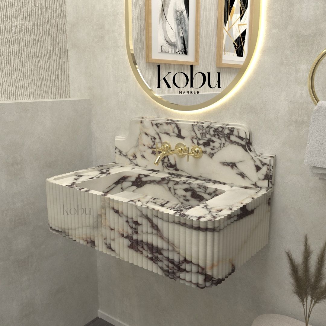 Installed 30-inch fluted Calacatta Viola marble sink in a modern bathroom, blending contemporary and classic aesthetics.