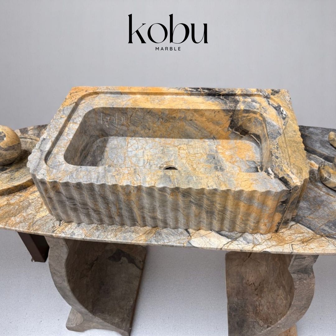 Front view of Azure 24-inch fluted marble sink, handcrafted with coastal elegance