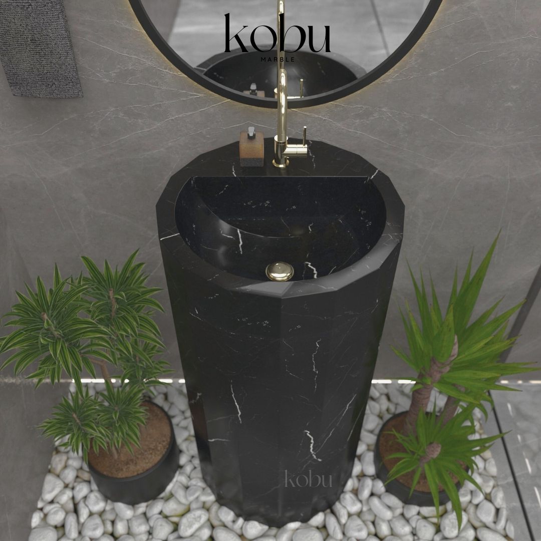 Front view of the Allia Model Nero Marquina marble pedestal sink, showcasing elegant veining and sleek design