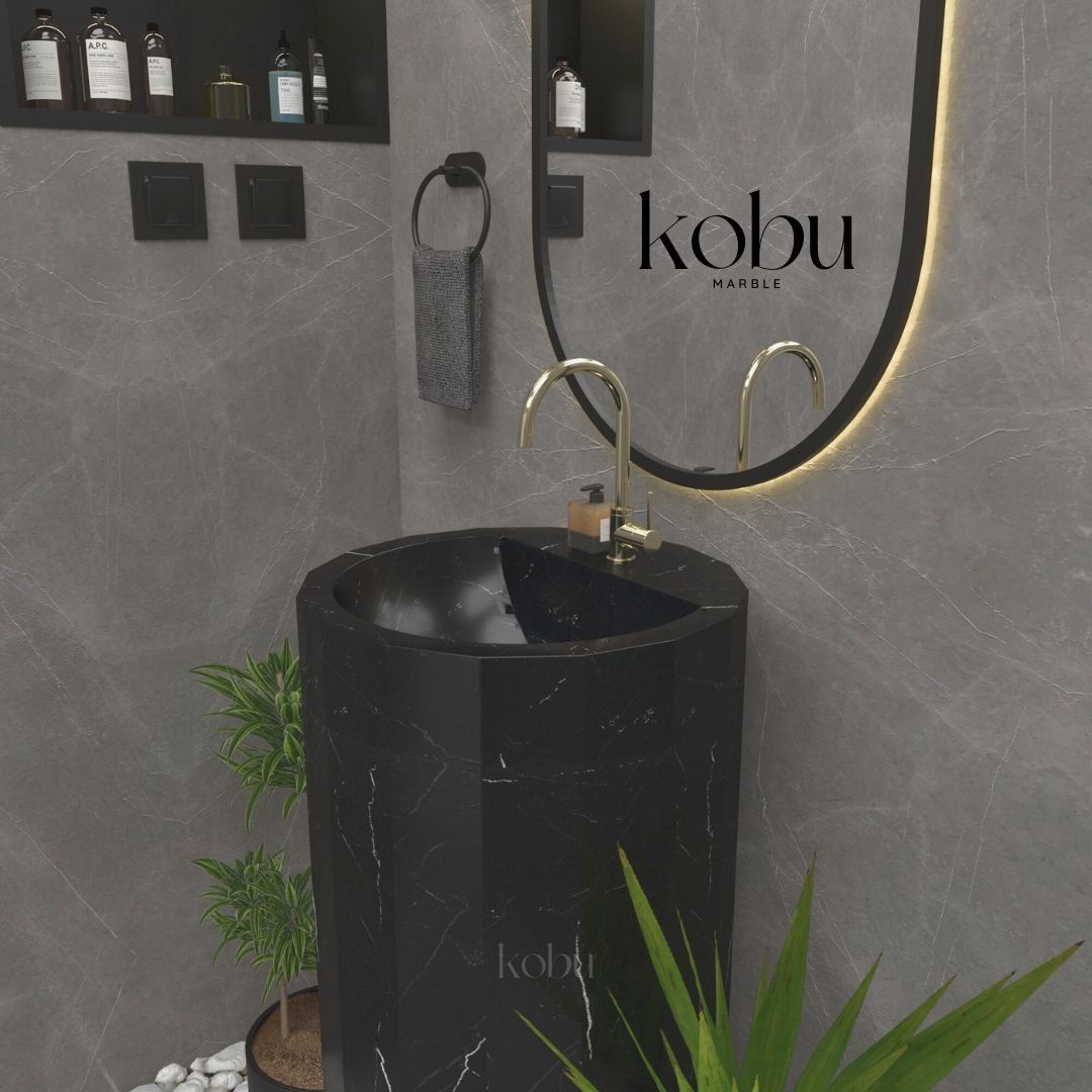 Side profile of the luxury Nero Marquina marble pedestal sink, highlighting its refined structure.
