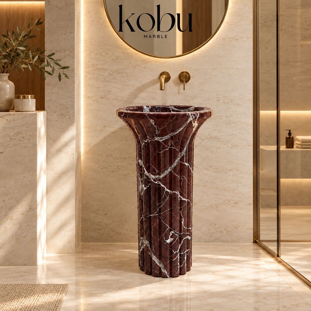 Rosso Levanto marble pedestal sink with a modern two-piece natural stone design and rich burgundy veining.