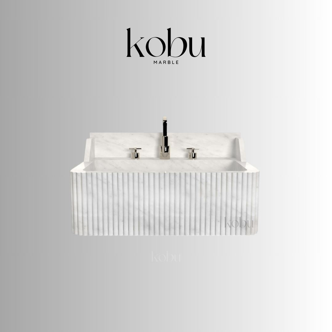 Installed floating white marble sink in minimalist powder room