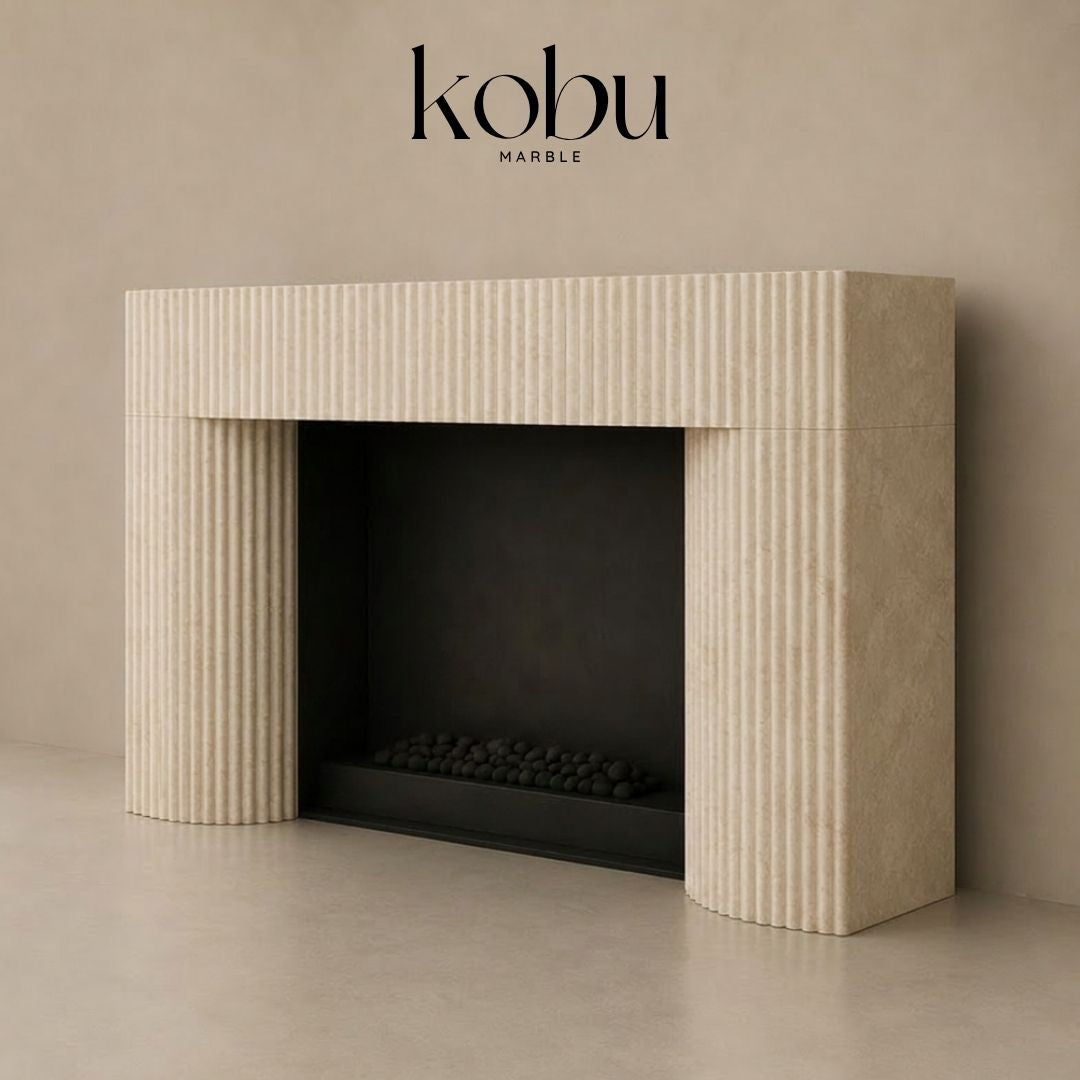 72 inch fluted travertine fireplace surround shown from an angled view with carved stone detail