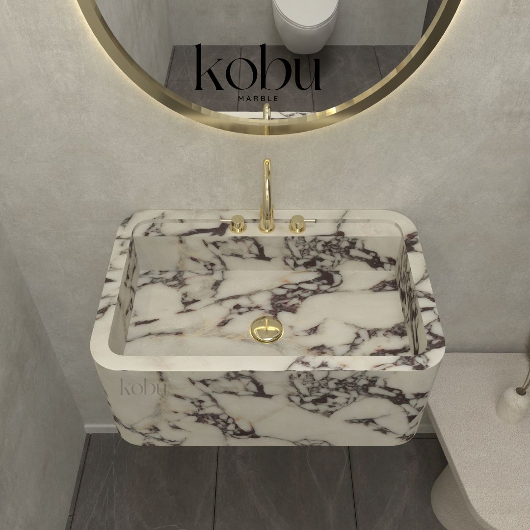 Detailed close-up of Calacatta Viola marble sink, showcasing its unique purple veining and natural texture.